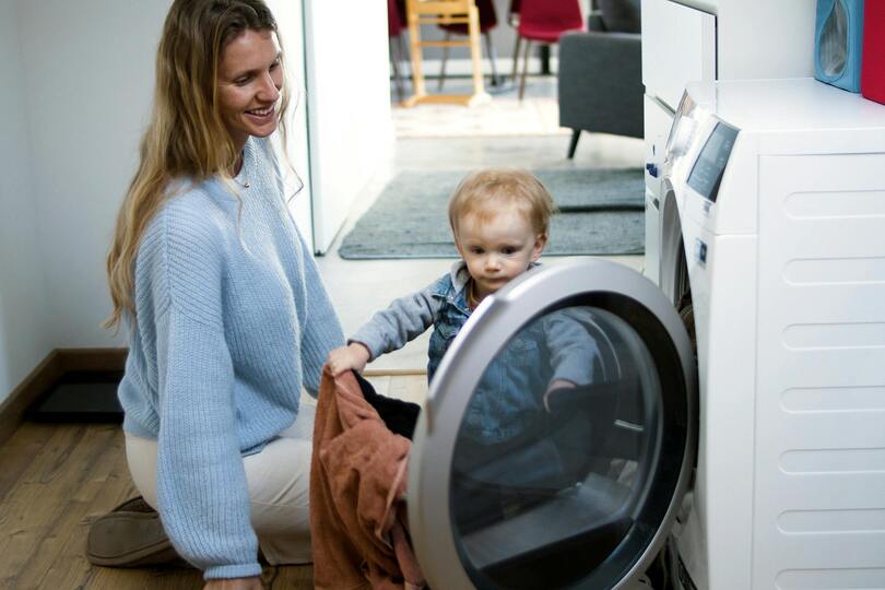 playing with toddler laundry hack for busy moms