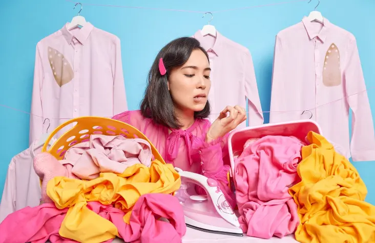 girl showing colorful shrinken clothes