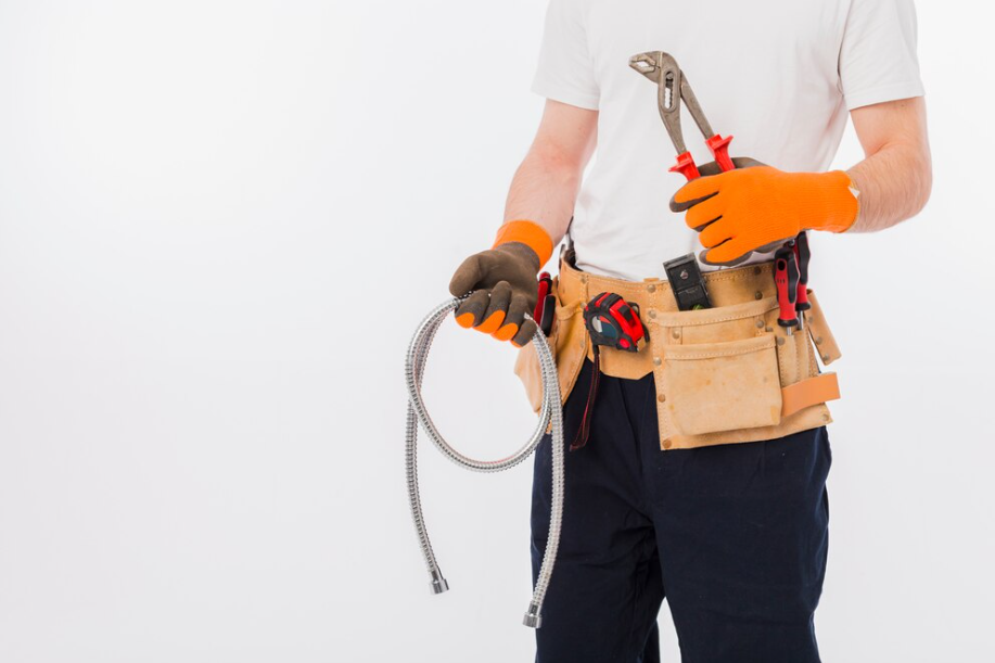 man holding plumbing tools