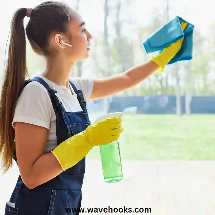 girl cleaning a window