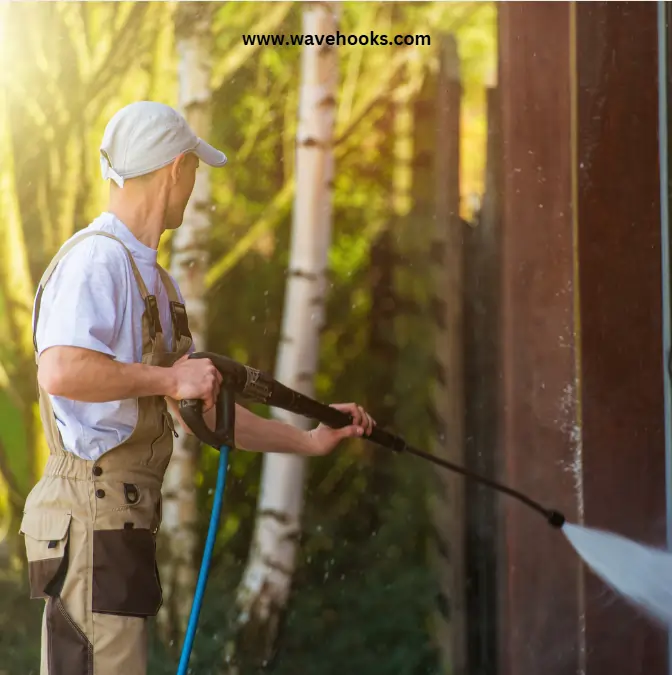 man cleaning his garage walls